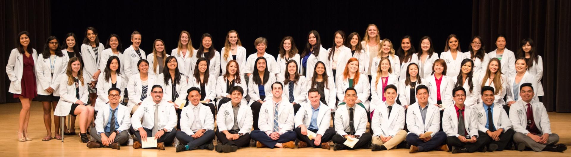 Nursing students receive white coats