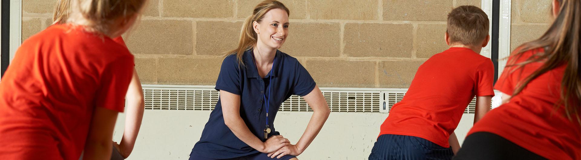 Physical education teacher leading class