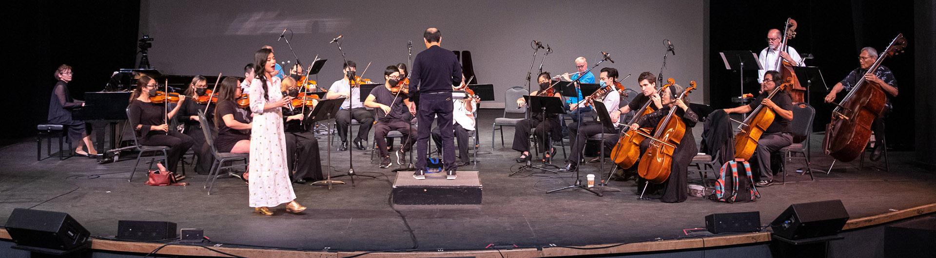Sangeeta Kaur practices with orchestra before a concert