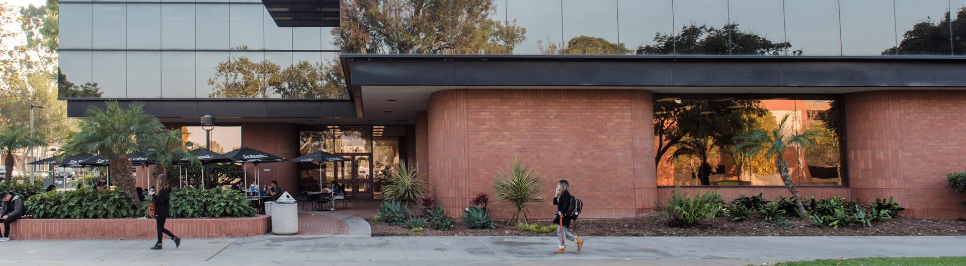 Students walk outside the College of Business Administration