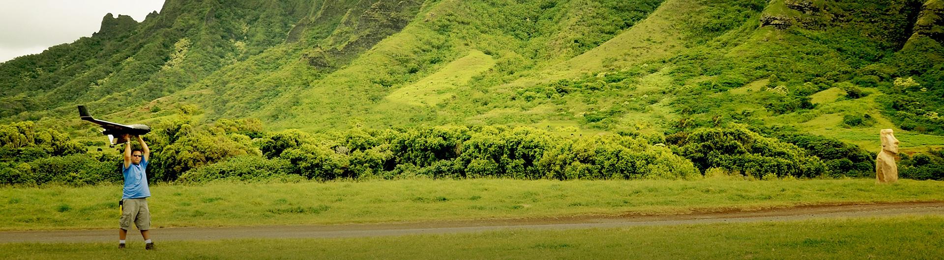 College of Liberal Arts Student in Hawaii with a glider plane