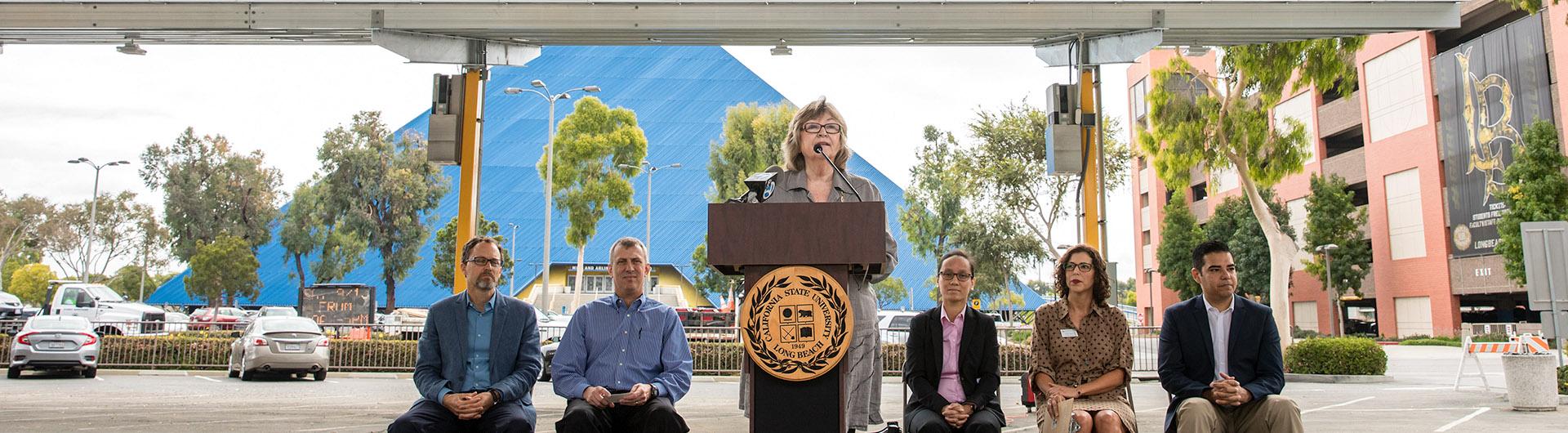  jane close conoley speaks at solar panel ribbon cutting