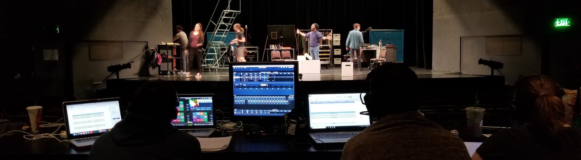 students working during a technical theatre rehearsal