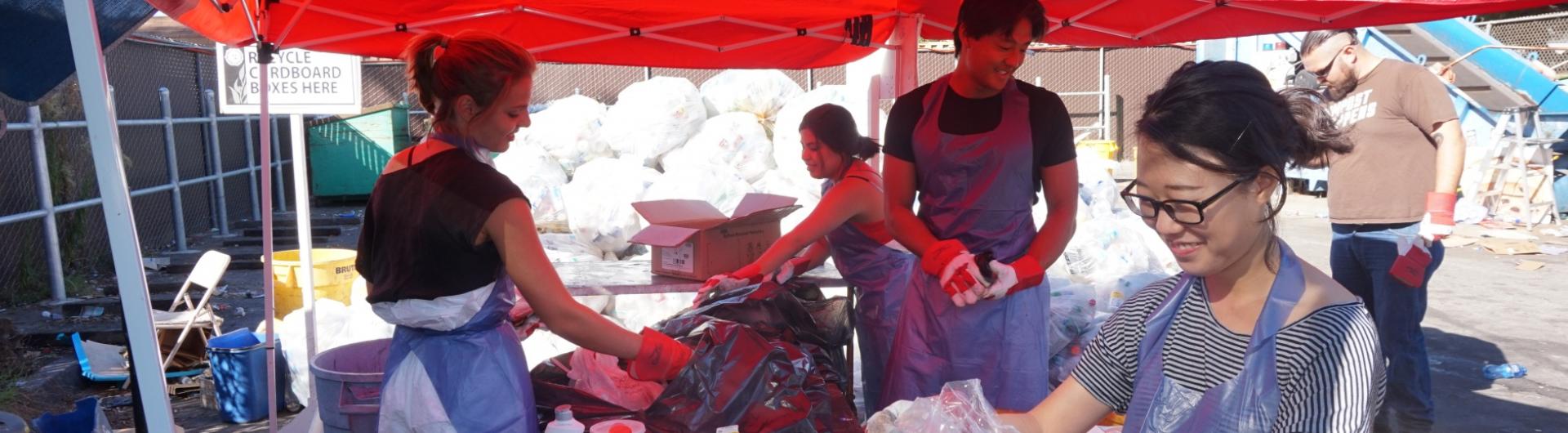 students participating in a waste audit at ASI Recycling Center