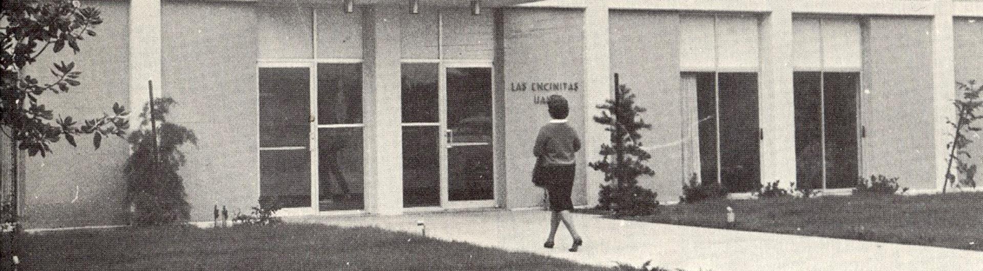 1960's campus image, student walking to campus