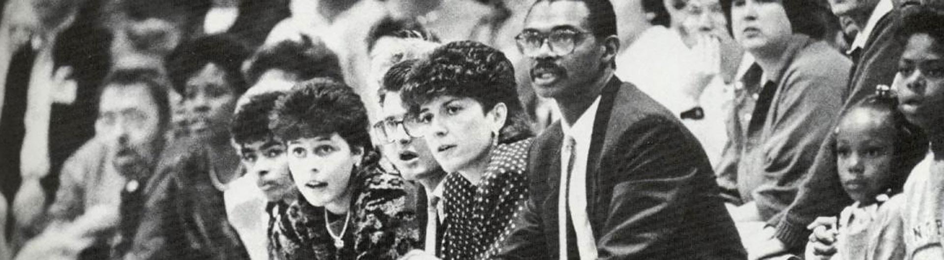 1980's campus, fans cheer the sports team