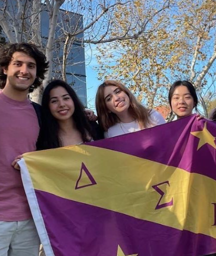 Students and Flag of Delta Sigma Pi - CSULB 2022