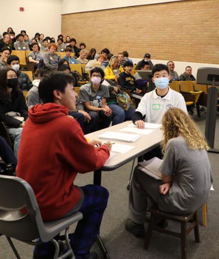 students facing off during math competition