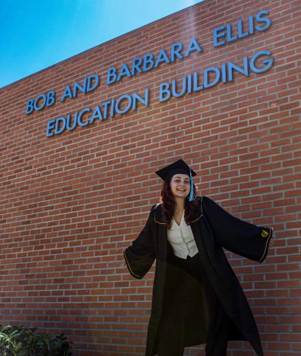 Chloe Haynes stands outside the College of Education building