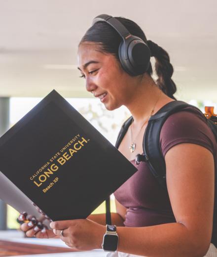 A student looks over her Beach XP folder on the first day of classes. 