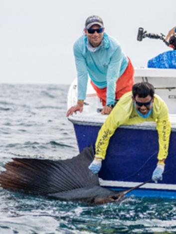 Ryan Logan and fellow researcher catching a sailfish