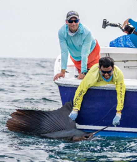 Ryan Logan and fellow researcher catching a sailfish