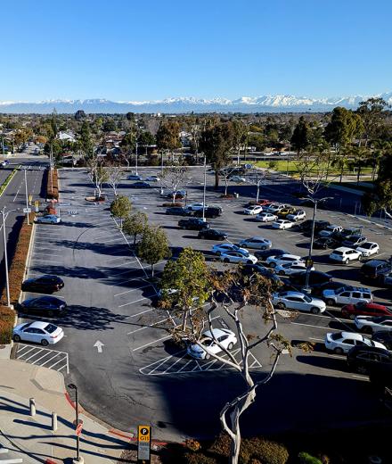 Parking lot with snowy mountains in the distance