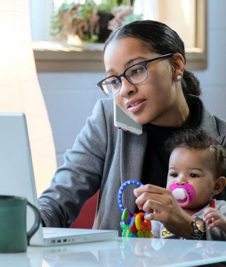 Mom with Toddler working