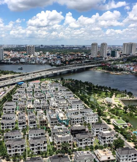 large city with bridges very dense houses a river crossing