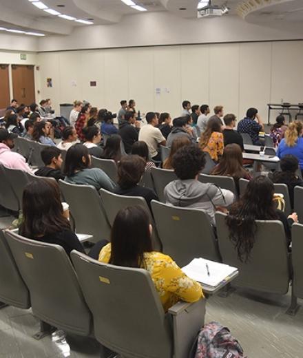 Group of students sitting in a classroom auditorium