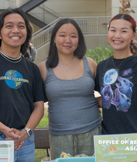 Three Asian American students posing for a photo together at the Asian, Pacific Islander, and DESI (APID) cultural welcome