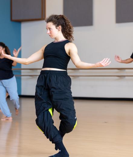 Maggie Ogle, center, learns repertoire during a workshop with A.I.M dancers