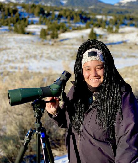 Taylor Rabe with telescope on a mountain