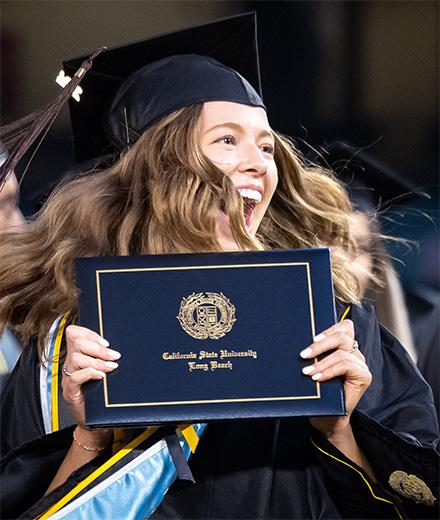 student celebrating at commencement
