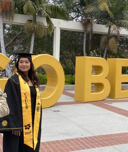 Photographer taking a photo of a green grads