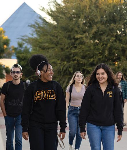 Students walking on the bridge, center of campus