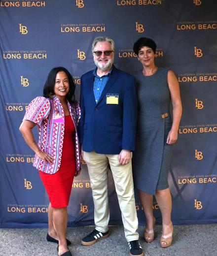 photo of 3 people posing 