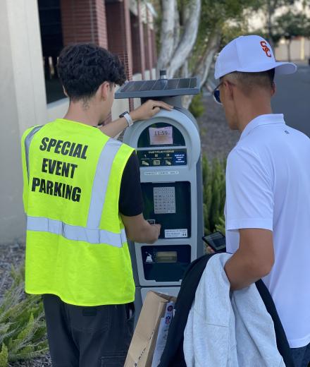 Event staff helping a customer