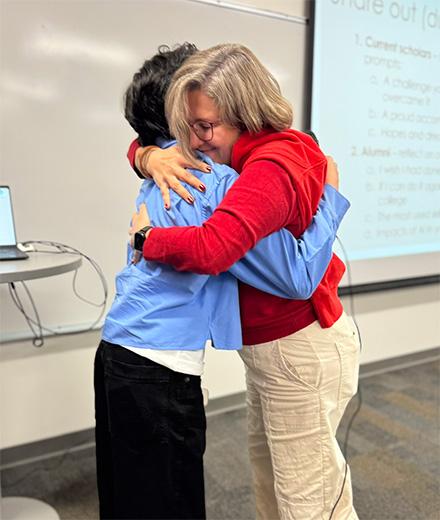 mentor and mentee sharing a hug