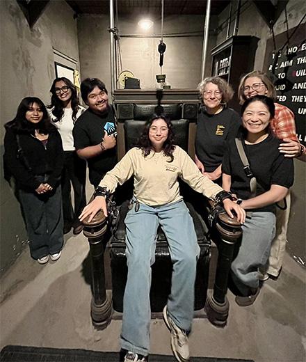 event participants posing in escape room