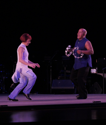 Linda Sohl-Ellison and Monty Ellison perform on stage.
