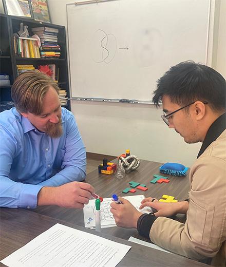 Dr. Ryan Blair and student researcher in the lab