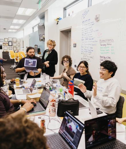 A newsroom meeting at the LB Current