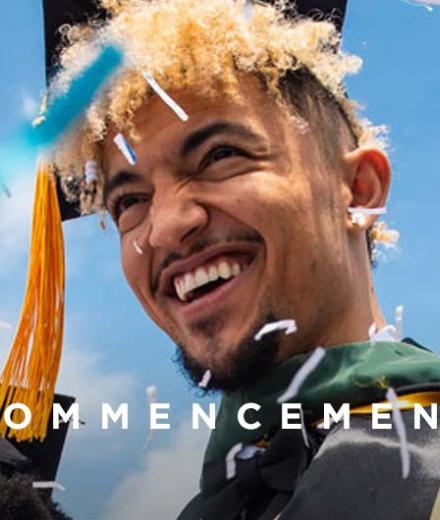 Graduate smiling in mortarboard