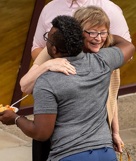 President Conoley hugging someone at Convocation 2018