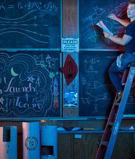 CSU Trustee winner Jayden Maree writes on chalk board
