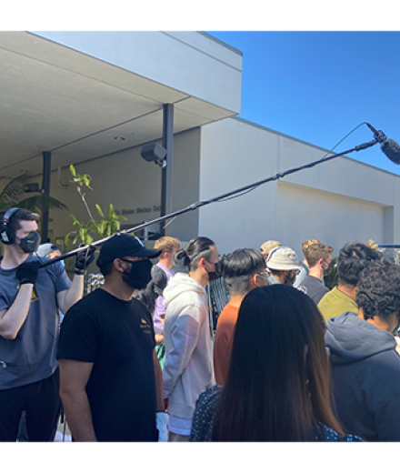 group of students with boom operator and microphone