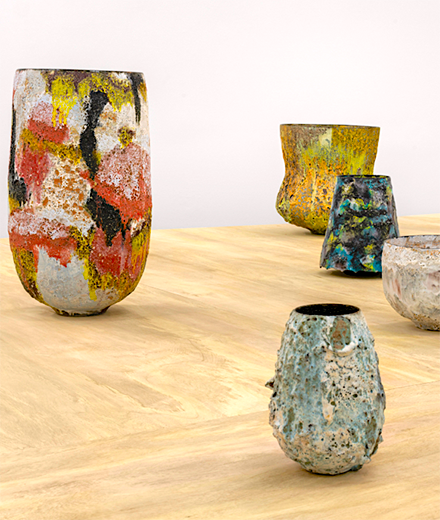 Multicolored ceramic pottery arranged on a table