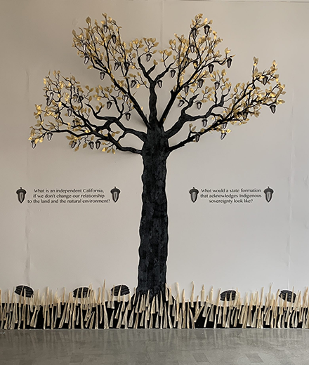 Gallery exhibit of a 3D tree with acorns