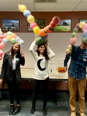 students wearing balloon hats