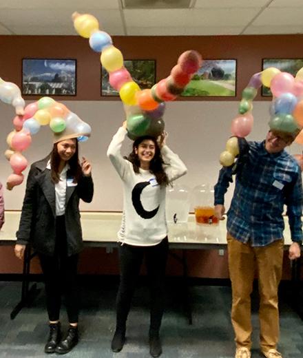 students wearing balloon hats