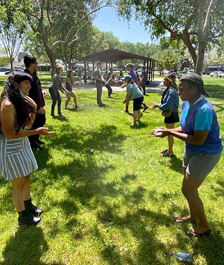 people doing a group activity in the park