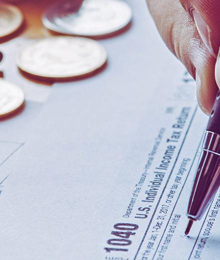 person filling out tax return