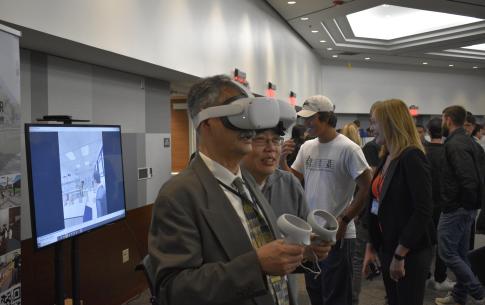 Professor trying on VR headset