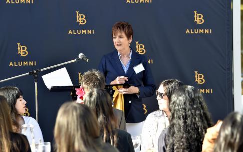 Alumna Diane Lee addresses the graduates at the Senior Send-Off