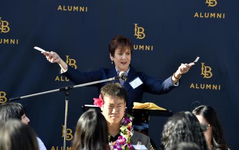 Alumna Diane Lee addresses the graduates at the Senior Send-Off