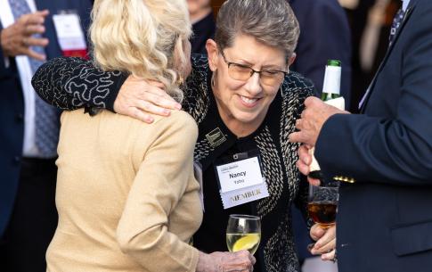 Woman hugging woman