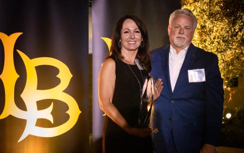 A woman accepting an award