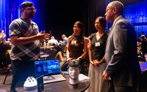 President Blanchard reviewing COTA student work