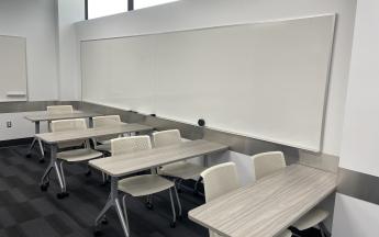 two chairs per desk lined up behind each other